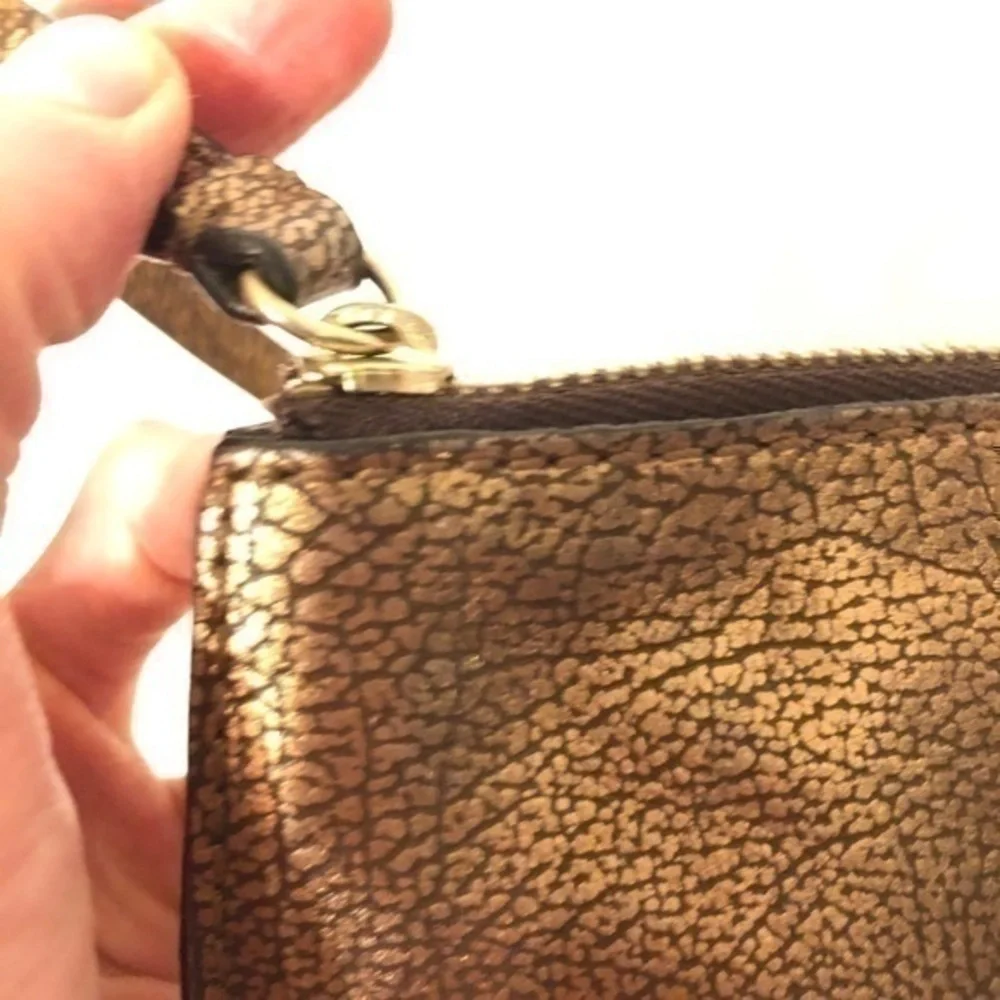 MICHAEL KORS wristlet mini bag studded metallic